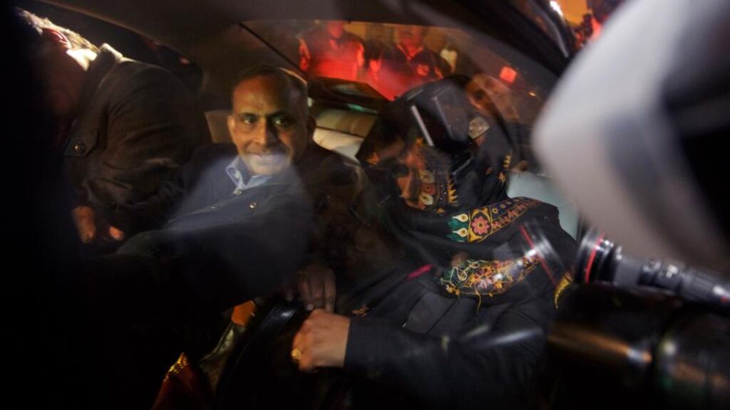 The father and a younger sister of Devyani Khobragade, the indicted diplomat accused of exploiting her housekeeper in New York, are surrounded by media at an airport in Delhi, India. Ms Khobragade has been transferred to a post in India Photograph: Kuni Takahashi/New York Times