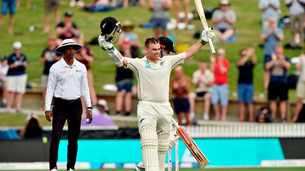 New Zealand’s batsman Tom Latham celebrates reaching his century on day one of the second Test against England at Seddon Park in Hamilton. Photo: Peter Parks/Getty Images
