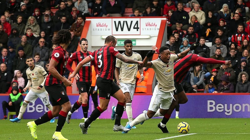 Anthony Martial is challenged by Jefferson Lerma but no penalty was given. Photo: Mark Kerton/PA Wire