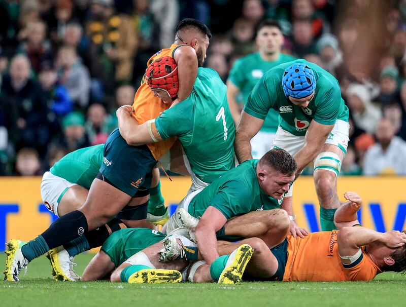 Ireland’s Josh van Der Flier is grabbed around the neck by Australia’s Jed Holloway in the ruck. Neck rolling seems to have become a pastime for the Wallabies. Photograph: Dan Sheridan/Inpho
