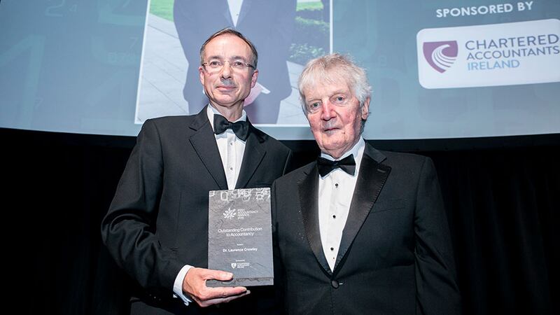 Barry Dempsey, Chief Executive, Chartered Accountants Ireland presents the Outstanding Contribution to Accountancy award to Dr. Laurence Crowley.