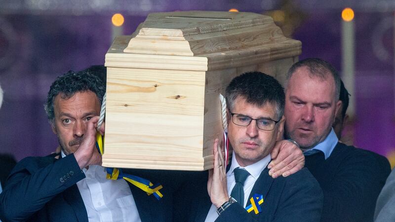 The Coffin of Pierre Zakrzewski is carried at the Church of Our Lady of Perpetual Succour, Foxrock. Zakrzewski’s brother, Greg, is pictured on the left. Photograph: Tom Honan