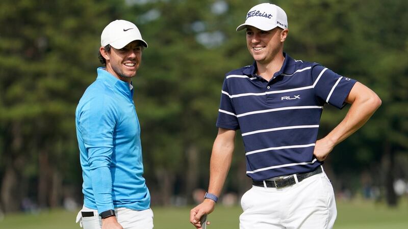 Rory McIlroy alongside Justin Thomas on the seventh hole during the opening round. Photo: Lee Jin-man/AP Photo