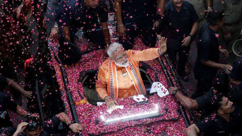 India’s prime minister Narendra Modi waves to supporters during a roadshow in Varanasi last April. Photograph: Adnan Abidi/Reuters