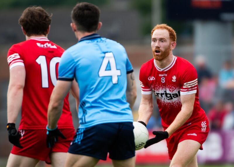 Derry’s Conor Glass and Ethan Doherty in action against Dublin’s David Byrne. Photograph: Evan Logan/Inpho