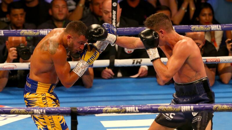 Vasiliy Lomachenko holds three of the lightweight belts after his win over Luke Campbell in London. Photograph: Steven Paston/PA