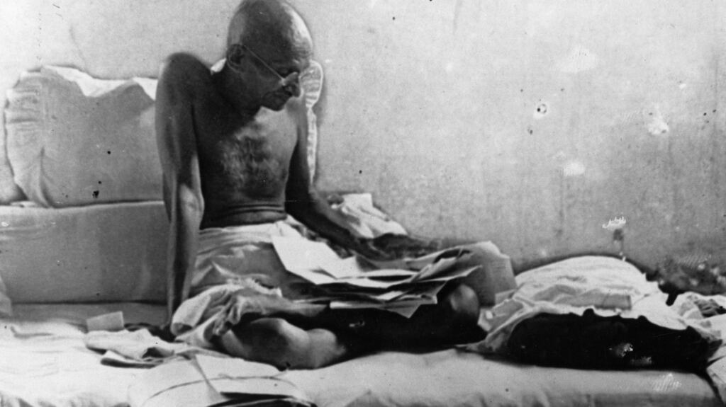 Mahatma Gandhi fasts in protest against British rule after his release from prison in Poona, India. Photo: Keystone/Getty Images