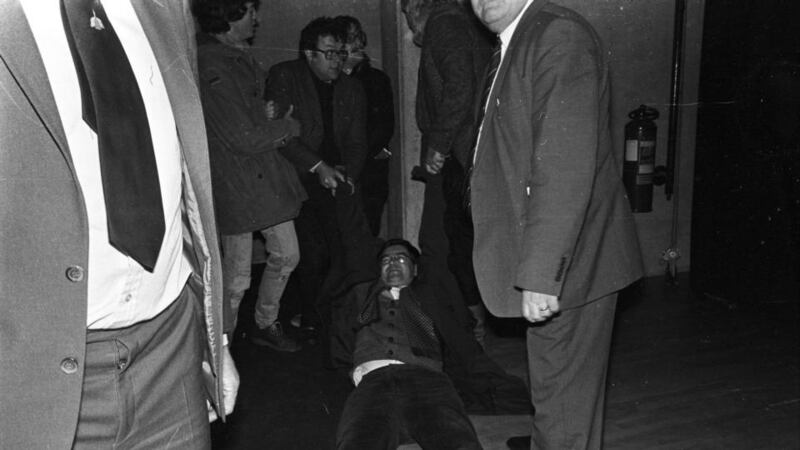 “My father was slightly embarrassed by my radicalism”: Joe Duffy is removed from a meeting at Trinity College Dublin in 1984, when he was students’ union president. Photograph: Kevin McMahon