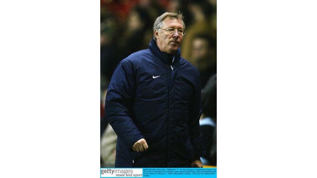 A dejected Manchester United manager Alex ferguson walks off after his side was defeated by Middlesbrough at Old Trafford on Wednesday night