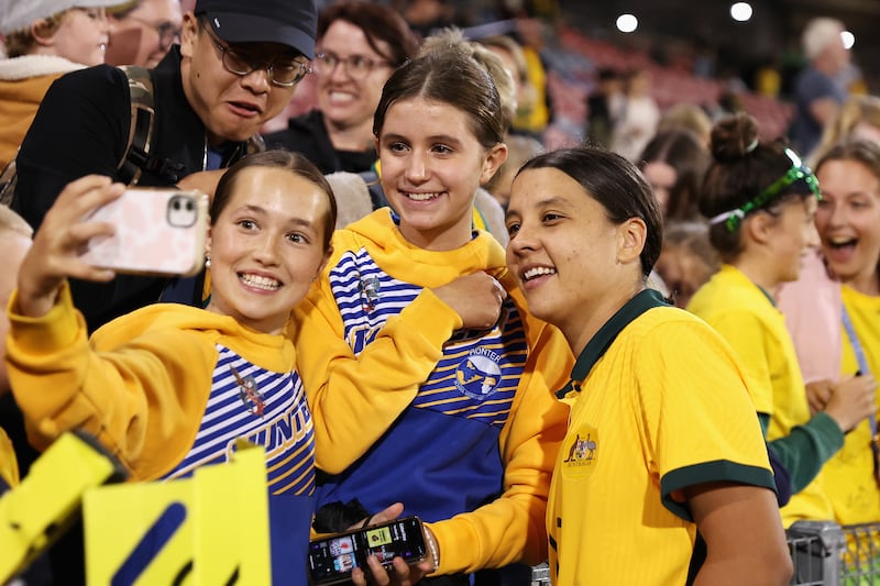 Sam Kerr of Australia poses with fans after winning the Cup of Nations match against Jamaica at McDonald Jones Stadium in Newcastle, Australia.The Chelsea star is one of Australia's most popular sporting heroes. Photograph: Cameron Spencer/Getty Images