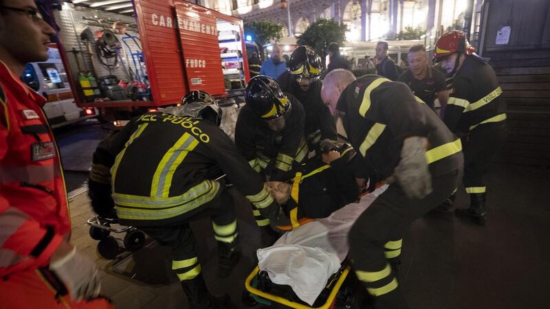 An injured victim is carried onto a stretcher after the collapse of the escalator in the ‘Repubblica’ subway station in Rome. Photograph: Peri-Percoss/EPA