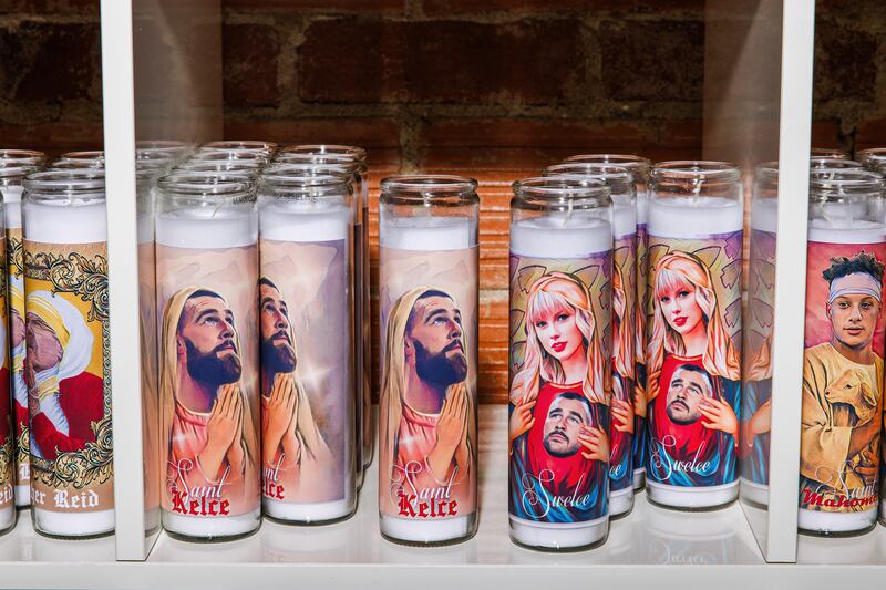 Prayer candles feature the images of Kansas City Chiefs player Travis Kelce and Taylor Swift. Photograph: Chase Castor/New York Times