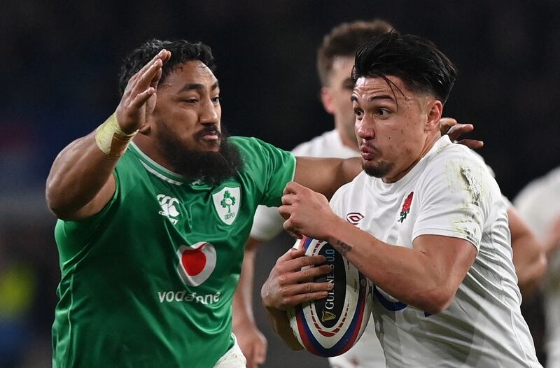 Ireland's centre Bundee Aki tackles England's Marcus Smith during the Six Nations match between England and Ireland at Twickenham. Photograph: Glyn KirkGetty Images