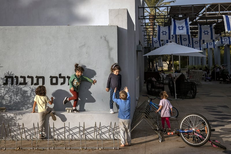 Children who survived the Hamas attack on Kfar Aza play near the hotel where they are living in Shefayim, Israel, this month. Photograph: Avishag Shar-Yashuv/New York Times