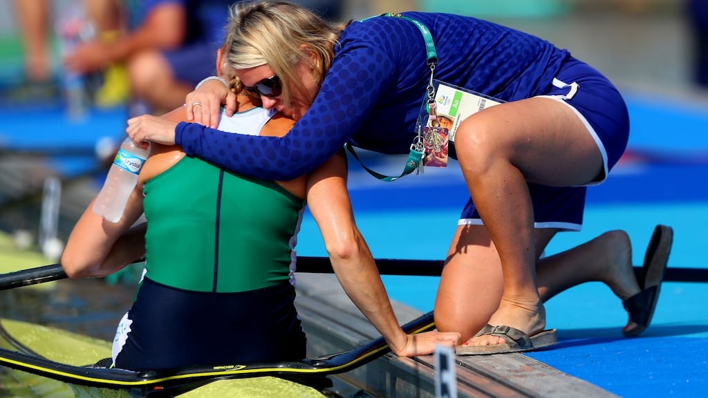 Sanita Puspure is consoled by physiotherapist Sarah Jane McDonnell after finishing fourth. James Crombie/INPHO