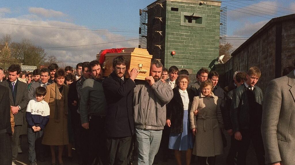 A file image showing the coffin of Aidan McAnespie being carried through the British army checkpoint where he was shot dead. Photograph: Pacemaker