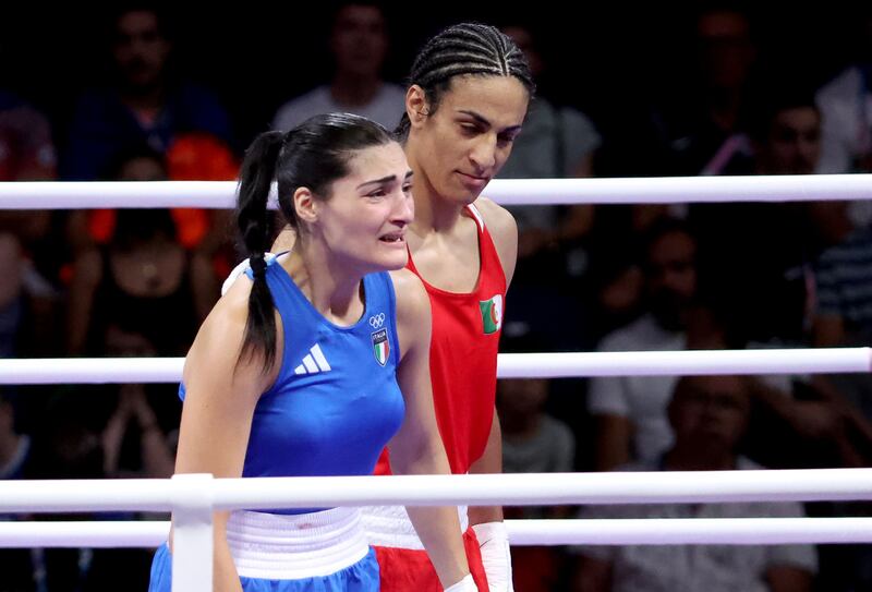 Italy's Angela Carini (left) abandons her bout in the women's 66kg preliminary round of 16 against Algeria's Imane Khelif. Photograph: Shutterstock