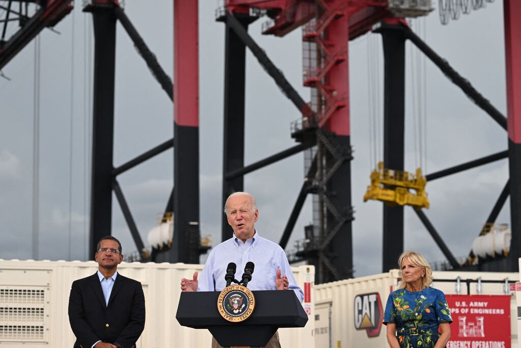 US president Joe Biden, flanked by first lady Jill Biden and Puerto Rico governor Pedro Pierluisi, speaking in the aftermath of Hurricane Fiona in Ponce, Puerto Rico. Photograph: Saul Loeb/AFP