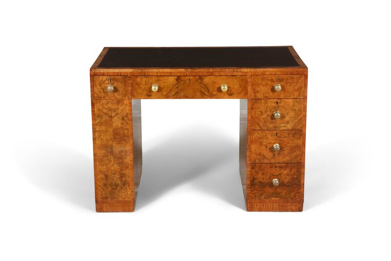Mid-20th century walnut kneehole writing desk, estimated at between €500 and €800.