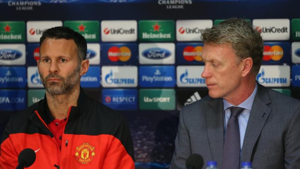 Manchester United manager David Moyes (right) alongside midfielder Ryan Giggs during a press conference at Old Trafford. Photograph: Alex Livesey/Getty Images
