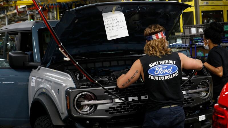 Line workers assemble a 2021 Ford Bronco at their Michigan Assembly Plant in Wayne, Michigan. Photograph: Jeff Kowalsky/AFP via Getty