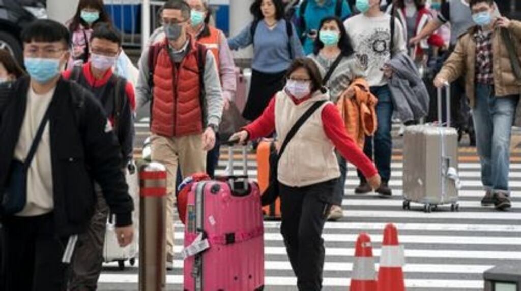 Chinese tourists  at Narita airport  in Japan.  Japan is one of the most popular  destinations for Chinese tourists during the Lunar New Year holiday. Photograph: Tomohiro Ohsumi/Getty Images
