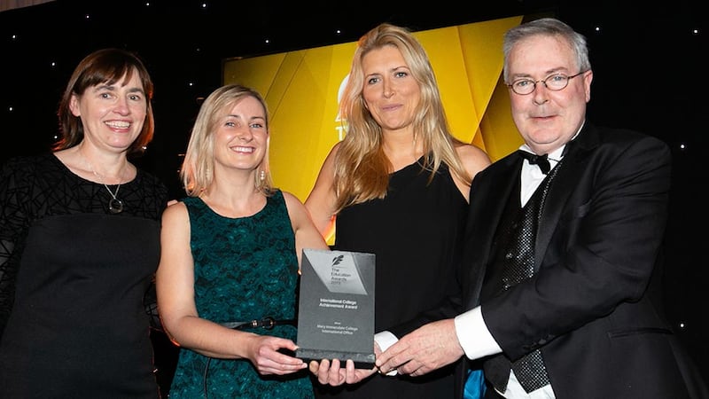 Prof. Louis Brennan, Trinity Business School presents the International College Achievement Award to Breeda Cahill, Cepta Kennedy and Holly Cowman, Mary Immaculate College International Office
