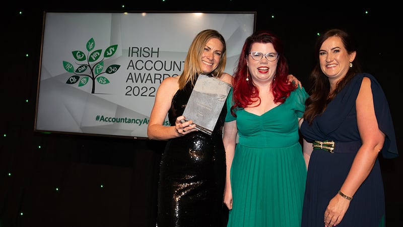 Roisin Nash, customer success manager, Circit, presents the COVID-19 Crisis Response Award to Anna Savage and Emer Brosnan, Fexco.