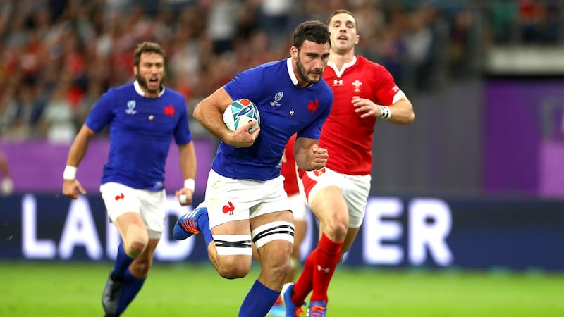 Charles Ollivon of France breaks away to go on and score his team’s second try against Wales at Oita Stadium. Photograph: Getty Images