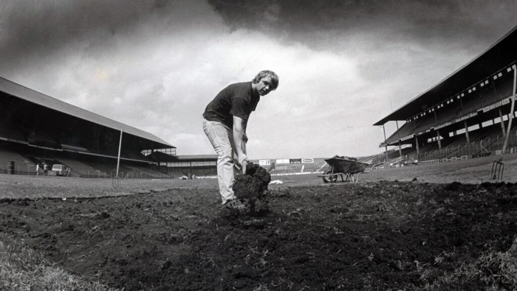 General view of a groundskeeper repairing the damage done to the pitch after the U2 concert which caused the postponement of the Leinster hurling final. Photograph: Inpho