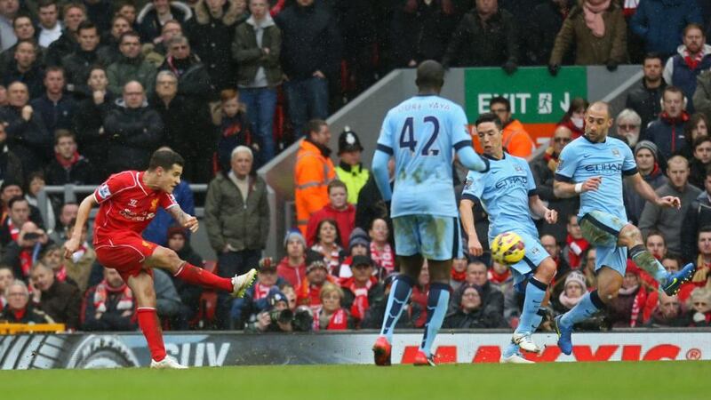 Liverpool’s Philippe Coutinho scores the winning goal against Manchester City. Photograph: Carl Recine/Reuters