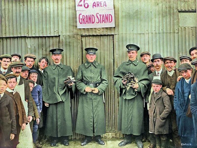 Day after Home Rule meeting showing policemen holding empty purses and onlookers at Celtic Park, Belfast. Photograph: National Museum of Northern Ireland from Old Ireland in Colour 2