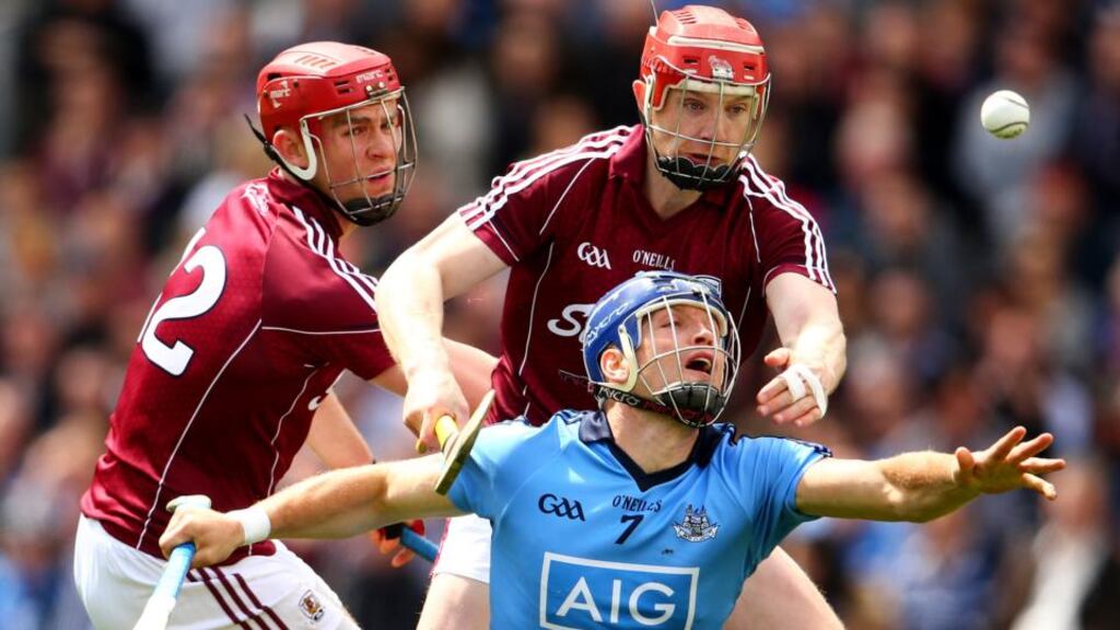 Galway’s Jonathan Glynn and Joe Canning tackle Dublin’s Conal Keaney. Photograph: Cathal Noonan/Inpho