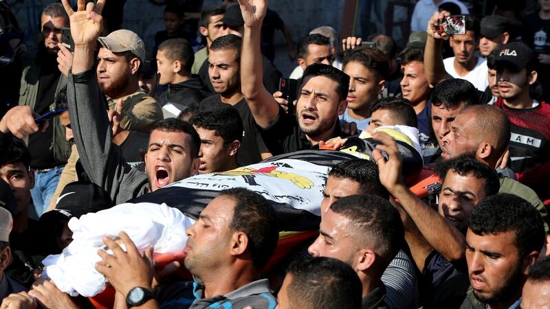 Mourners carry the body of Baha Abu Al-Atta during his funeral in Gaza City on Tuesday. Photograph: Mohammed Salem/Reuters