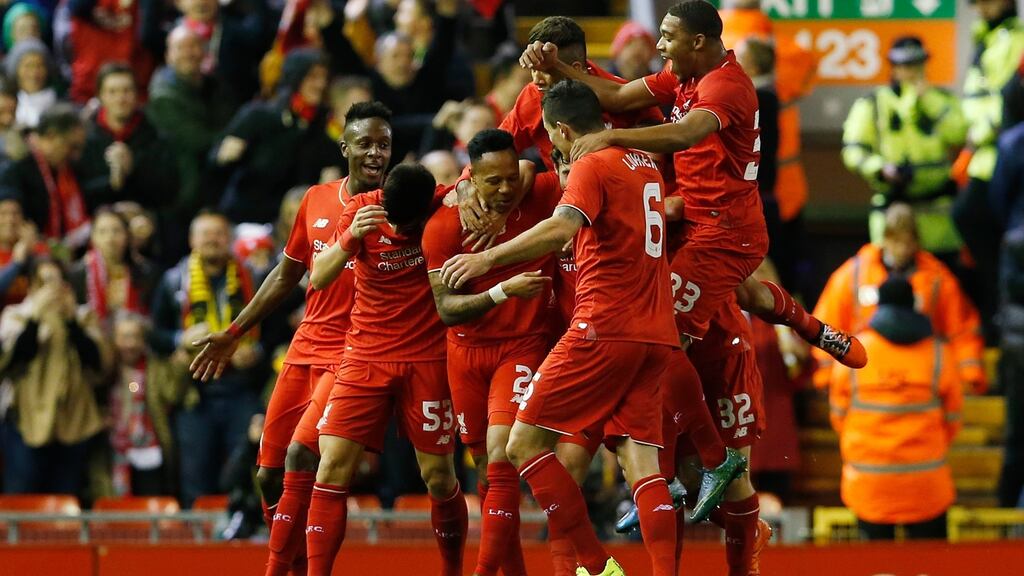 Liverpool’s Nathaniel Clyne celebrates with his team mates after putting Liverpool 1-0 up in their Capital One Cup win over Bournemouth. Photo: Lee Smith/Reuters
