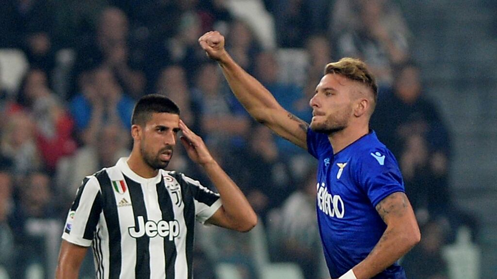 Lazio’s Ciro Immobile celebrates scoring his second second goal as Juventus’ Sami Khedira looks on during the Serie A match at Juventus Stadium. Photograph: Massimo Pinca/Reuters