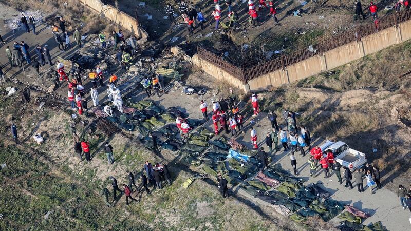 An areal view from a helicopter shows a general view of the crash site as members of emergency services workers and members of the International Red Crescent work next to the wreckage. Photograph: Ruhollah Vahdati/EPA