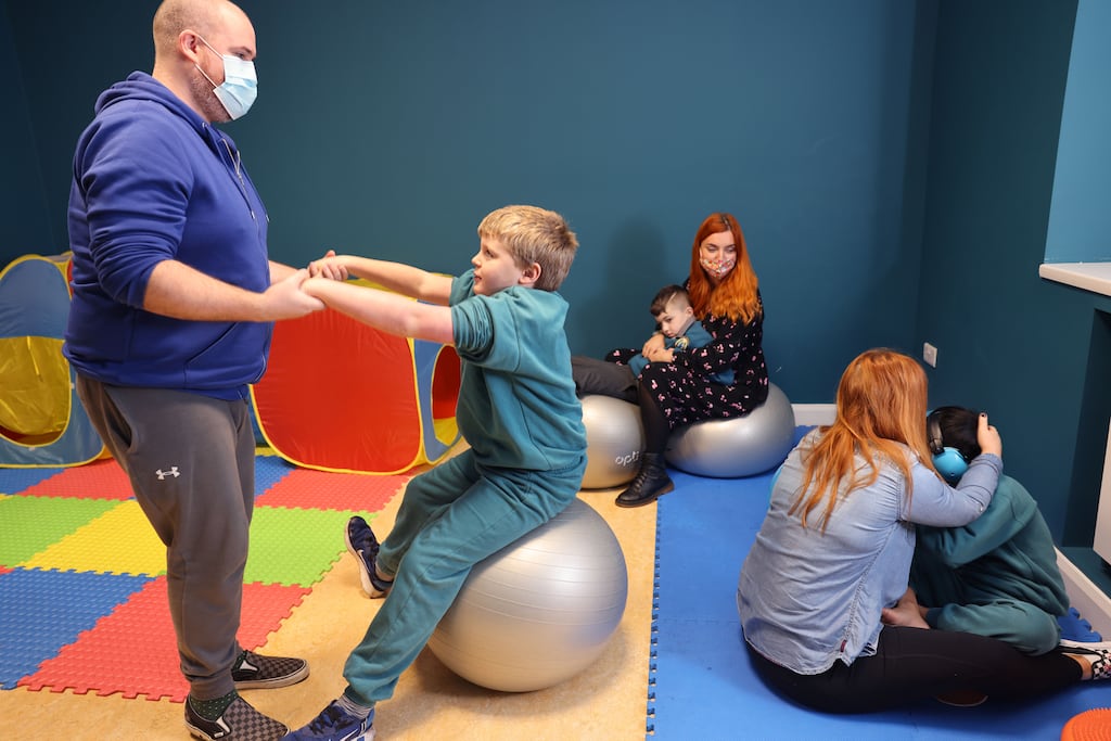 Teacher Jason Kelly, with SNA Chantelle Davis and SNA Sandra Keogh, in the special class for children with autism in Cnoc Mhuire Senior School, Killinarden, Dublin. An AsIAm poll indicates the scale of unmet demand for school places is significantly greater than official data. Photograph: Dara Mac Dónaill