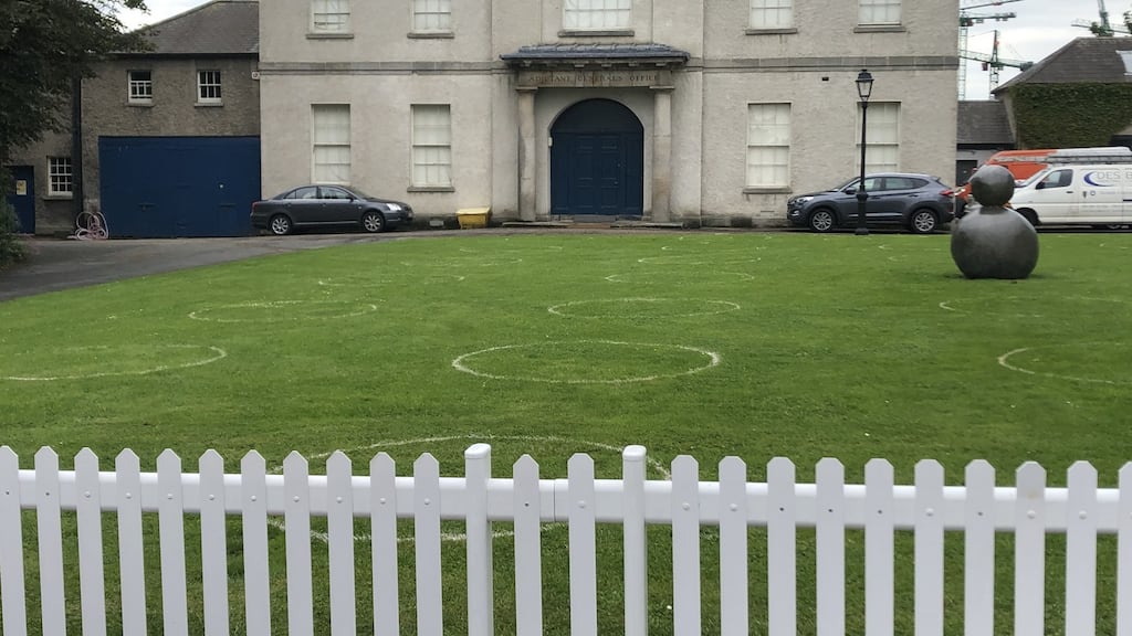 The socially distanced patches of grass within which you are encouraged to enjoy your coffee and muffins at the Royal Hospital Kilmainham are marked with white circles, which adds to the sense of oddness.