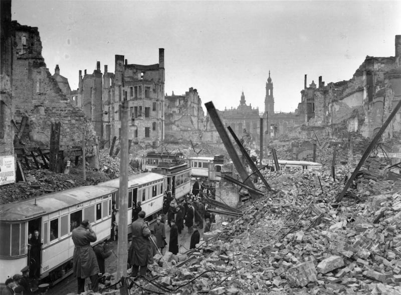 People getting on trams in the midst of the ruins left by an Allied air raid on Johannstrasse, Dresden, in the Soviet zone of Germany after the Second World War. Photograph: Fred Ramage/Keystone Features/Getty Images