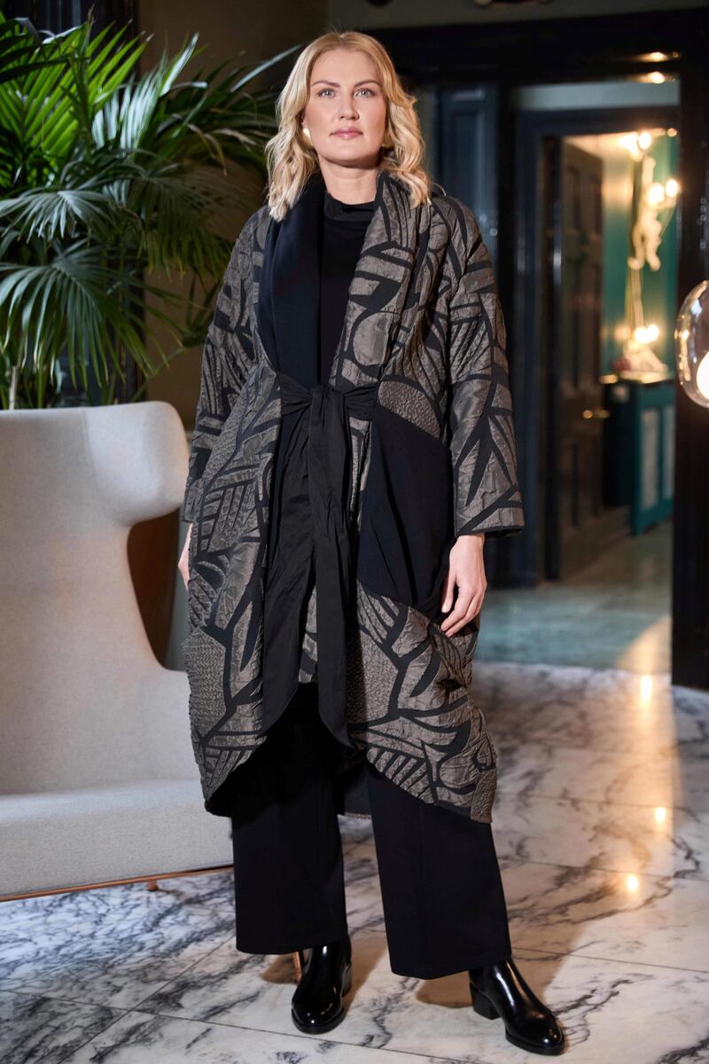 Embossed jacquard print coat, €297, long sleeve top with cut-away collar, €146, elasticated waist trousers, €101, from Ora  and Choice boutiques