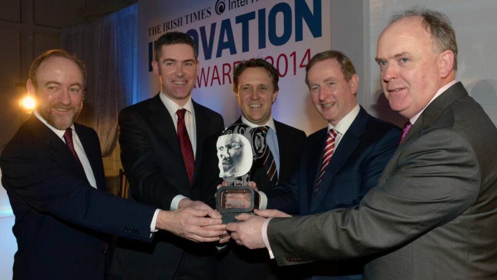 Taoiseach Enda Kenny TD presenting the Irish Times InterTradeIreland Innovation Award to Eoin Casey and Wayne Byrne of Oxymem, the overall winners of 2014 The Irish Times InterTradeIreland Innovation Awards. Also pictured is Thomas Hunter McGowan (left), CEO InterTradeIreland, and Liam Kavanagh (right), MD The Irish Times. Photograph: Brenda Fitzsimons