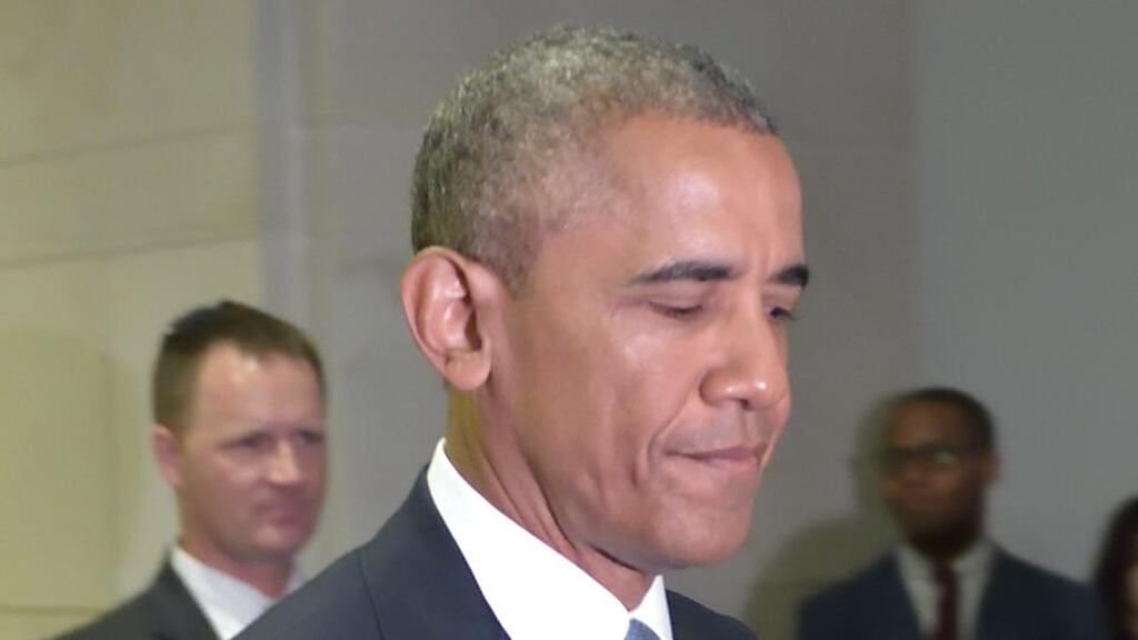 US President Barack Obama walks through a hallway after meeting with House Democrats at the US Capitol in Washington. Photograph: Mandel Ngan/Getty Images