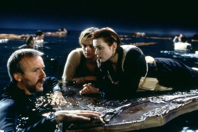 Titanic: Director James Cameron with Leonardo DiCaprio and Kate Winslet during the filming of the 1997 film's floating-door scene. Photograph: 20th Century Fox