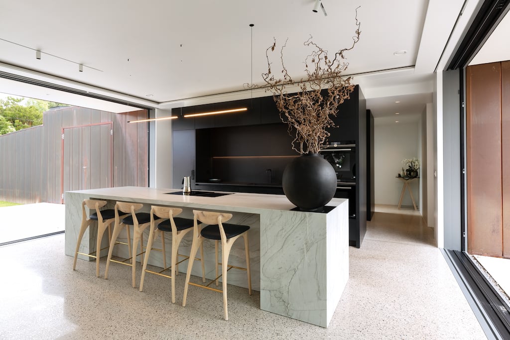 Durable worktops like porcelain or quartzite combine the benefits of real stone without the upkeep, and offer a hard-working and beautiful counter. Photograph: Noel Dempsey Design