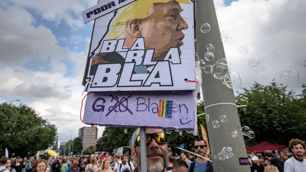 Hamburg protester’s placard of President Donald Trump at the G20 Summit: Seeing as he is so quick to take the credit for a bull market, will he also take the blame when things eventually sour? Photograph: Thomas Lohnes/Getty Images