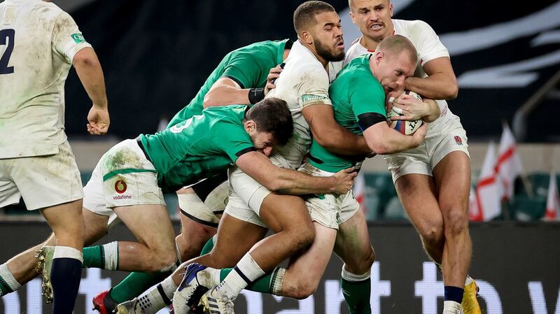 Ireland’s Keith Earls is tackled by Ollie Lawrence and Henry Slade of England during the Autumn Nations Cup match at Twickenham. Photograph: Billy Stickland/Inpho