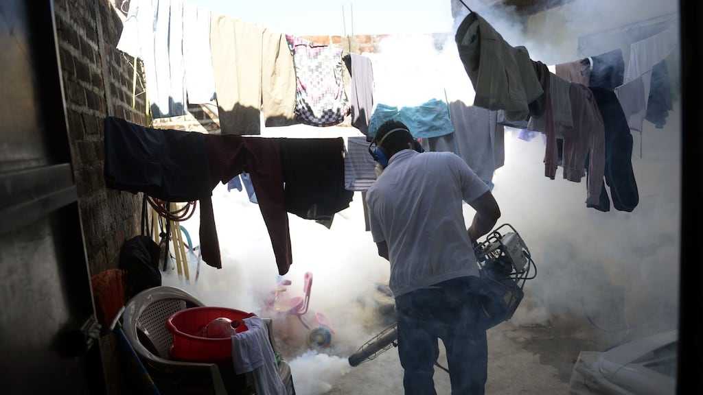 A health ministry employee fumigates a home against the Aedes aegypti mosquito to prevent the spread of the Zika virus in Soyapango, San Salvador. Health authorities have issued a national alert against the Aedes Aegypti mosquito, because of the link between the Zika virus and microcephaly and Guillain-Barré Syndrome in fetuses. Marvin Recinos/AFP/Getty Images.