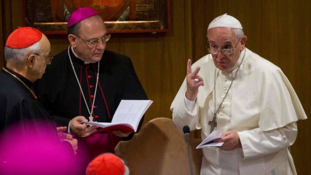 Pope Francis talks to prelates as he arrives for a morning session of a two-week synod on family issues, at the Vatican, yesterday. Photograph: AP Photo/Alessandra Tarantino