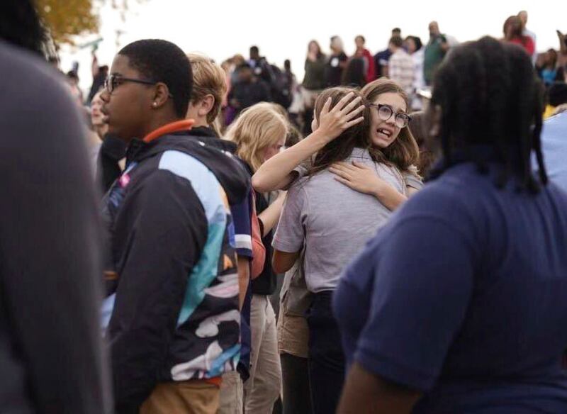 People gather outside after a shooting at Central Visual and Performing Arts high school in St Louis. Photograph: Jordan Opp/St Louis Post-Dispatch via AP/PA.